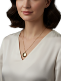 Round gold locket on chain